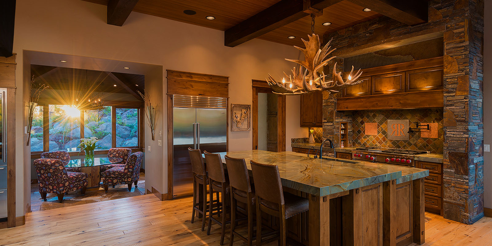Kitchen inside a luxury homes in Redmond, OR themed with woods and brown color